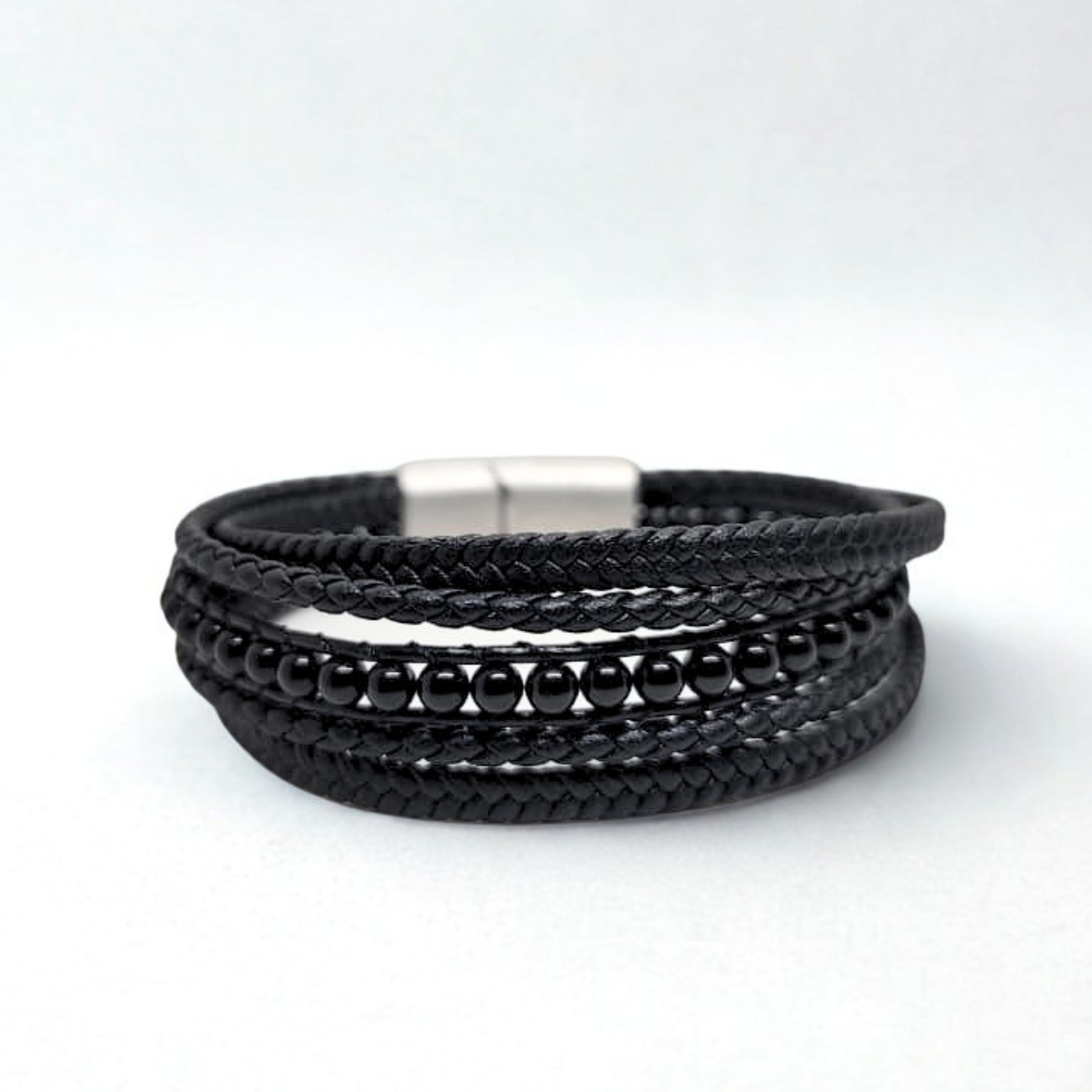 Premium Black Leather Sleek Men's Bracelet by Overpowered Accessories features braided leather and black beads, secured with 