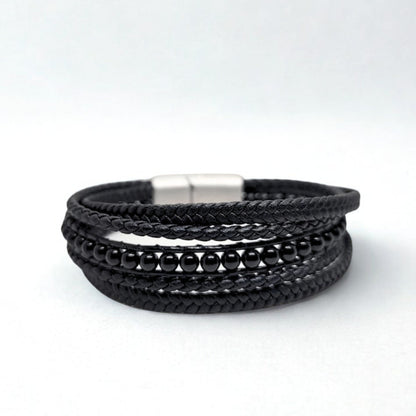 Premium Black Leather Sleek Men's Bracelet by Overpowered Accessories features braided leather and black beads, secured with 