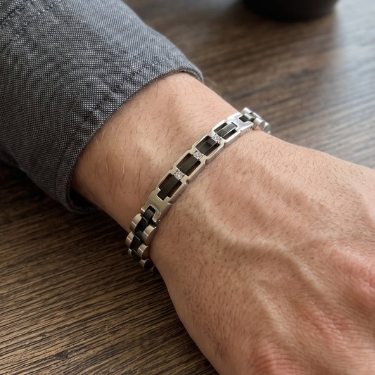 Stainless steel bracelet with silver and black rectangular links and square accent stones