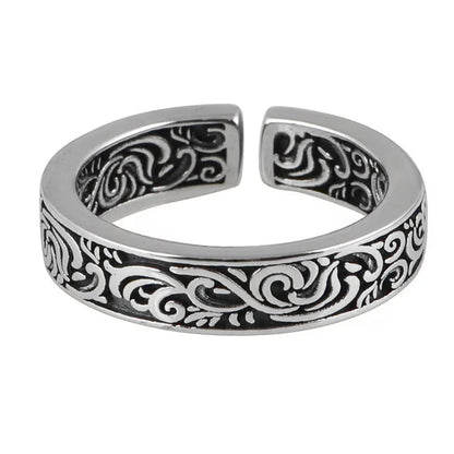 Silver tone men’s ring with black and white scrollwork band