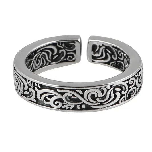 Silver tone men’s ring with black and white scrollwork band