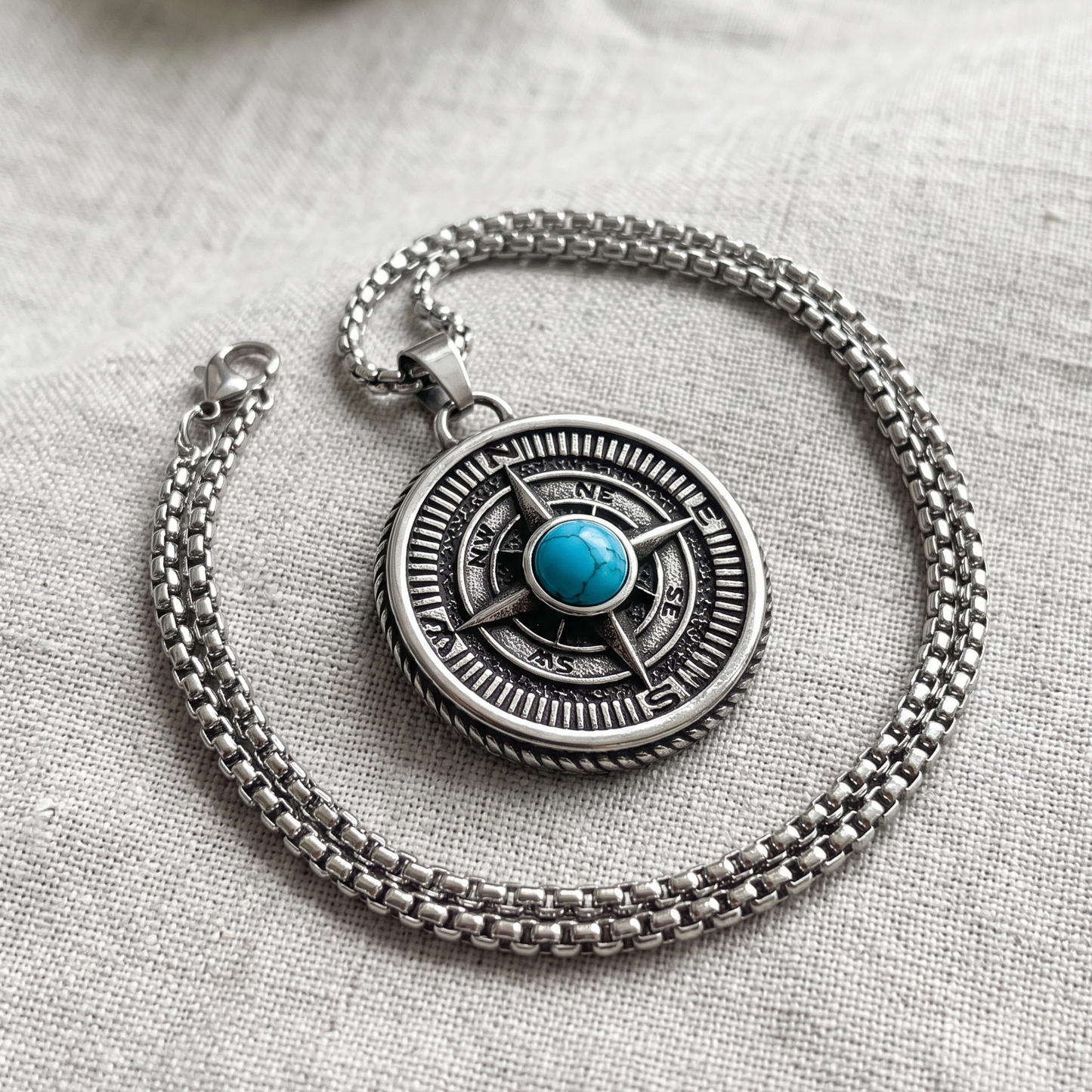 Compass pendant and silver chain necklace, round medallion with blue turquoise center stone