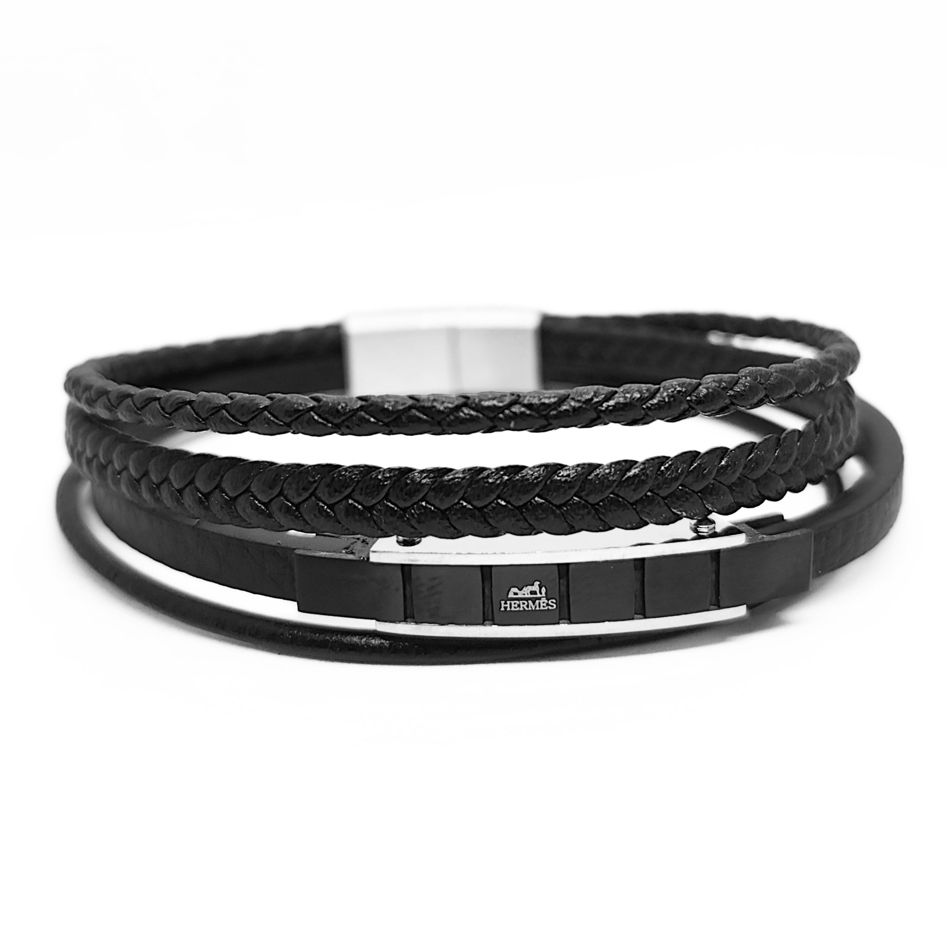Black leather bracelet with braided cuff, smooth band stack, and silver-toned clasp