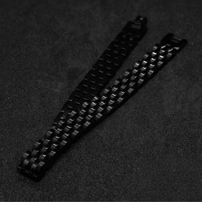 Sleek Black Stainless Steel B-16 Bracelet by Overpowered Accessories, featuring a woven design on a dark background.