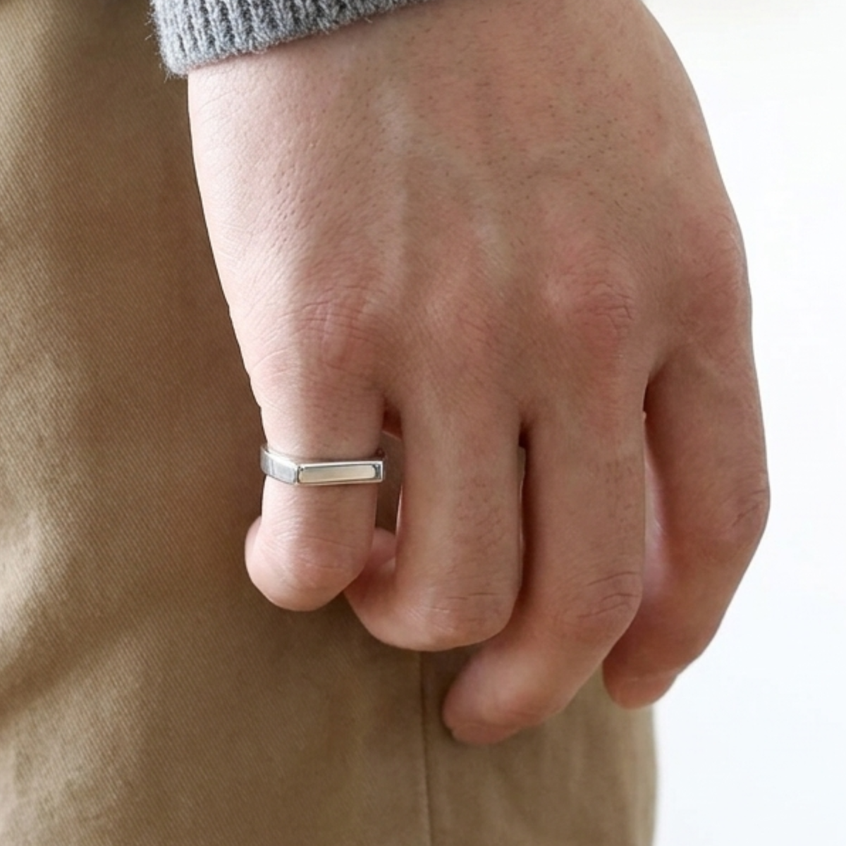 R-9 men's silver steel signet ring, side view of the smooth band