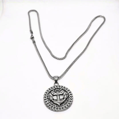 Silver steel necklace featuring an anchor pendant with a decorative circular design, from Overpowered Accessories.