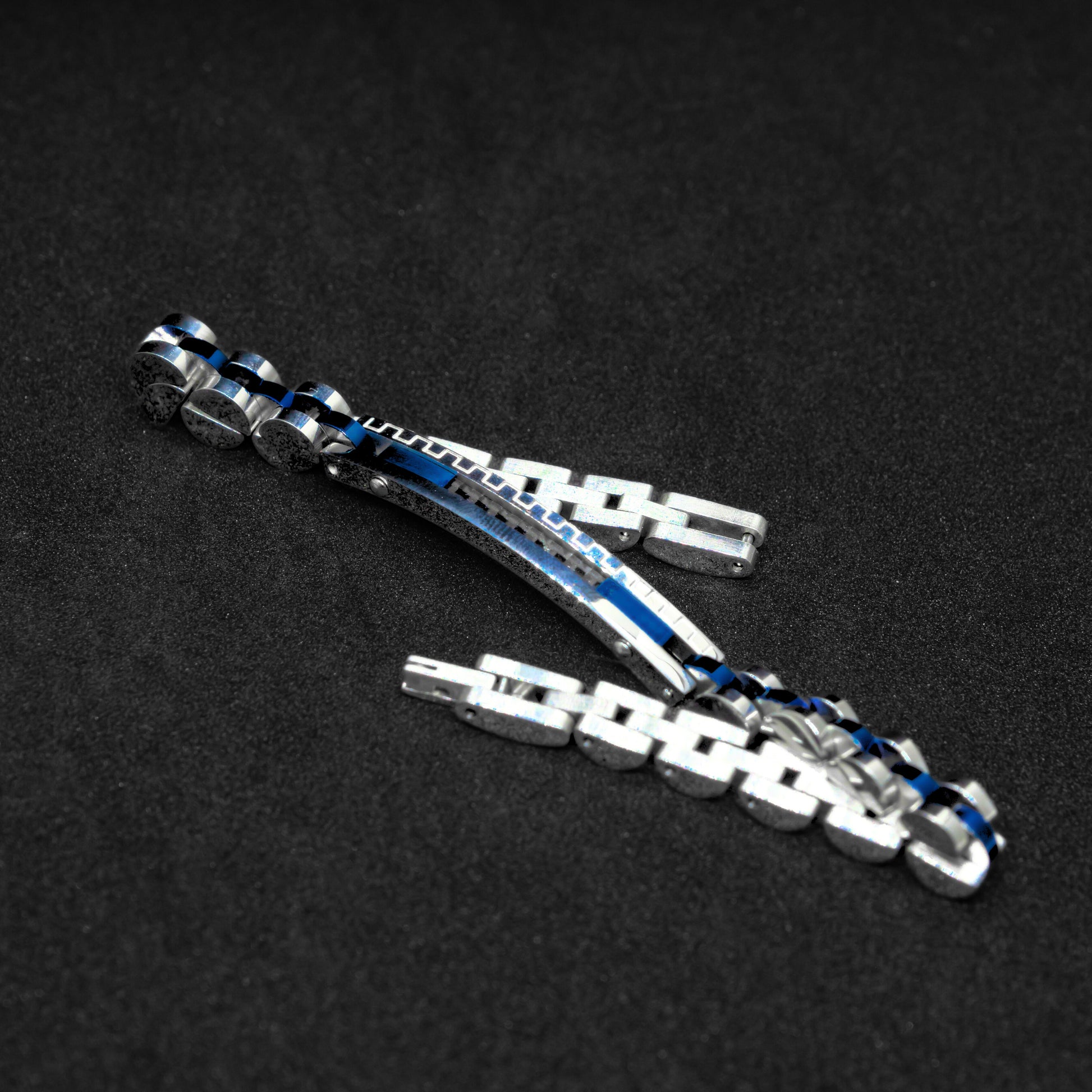 Two-tone silver and blue stainless steel B-39 bracelet for men, featuring a sleek design with interlocking links.