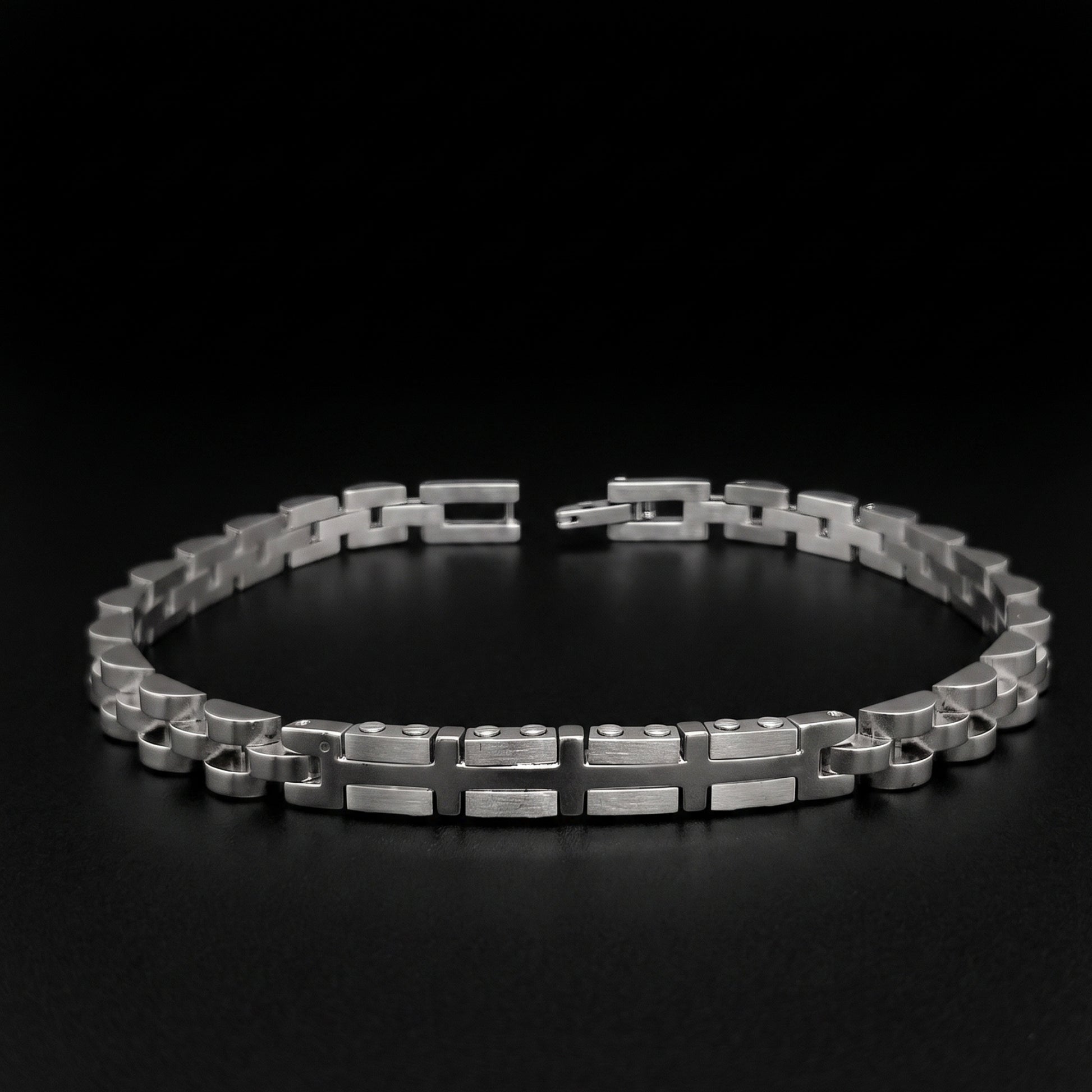 Silver stainless steel bracelet with geometric link pattern, open cuff view
