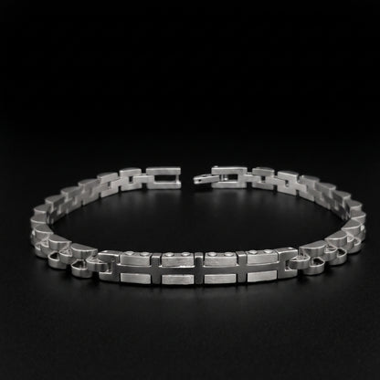 Silver stainless steel bracelet with geometric link pattern, open cuff view