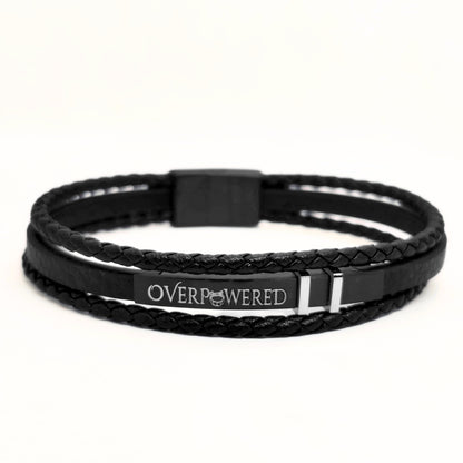 Black leather braided wrap bracelet with central black strap clasp and OVERPOWERED logo