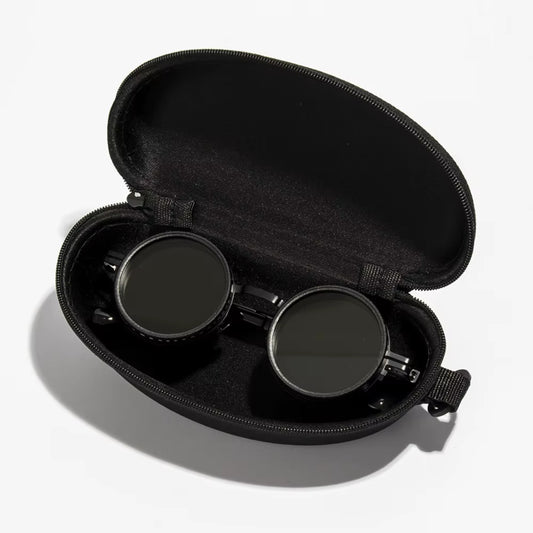 Black zippered case containing round sunglasses, showcasing a sleek and stylish design.