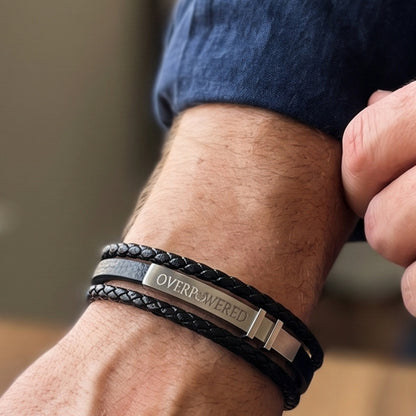 Men's black leather bracelet with braided wrap and silver clasp, adjustable buckle