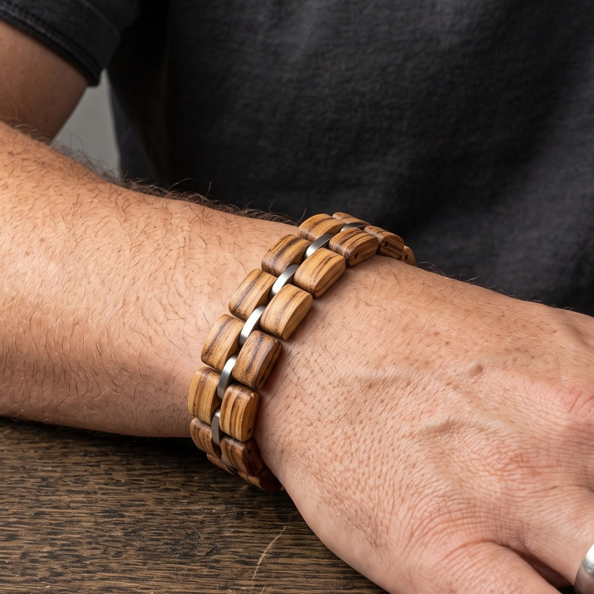Zebrawood bracelet worn on wrist with silver metal links, Overpowered Accessories