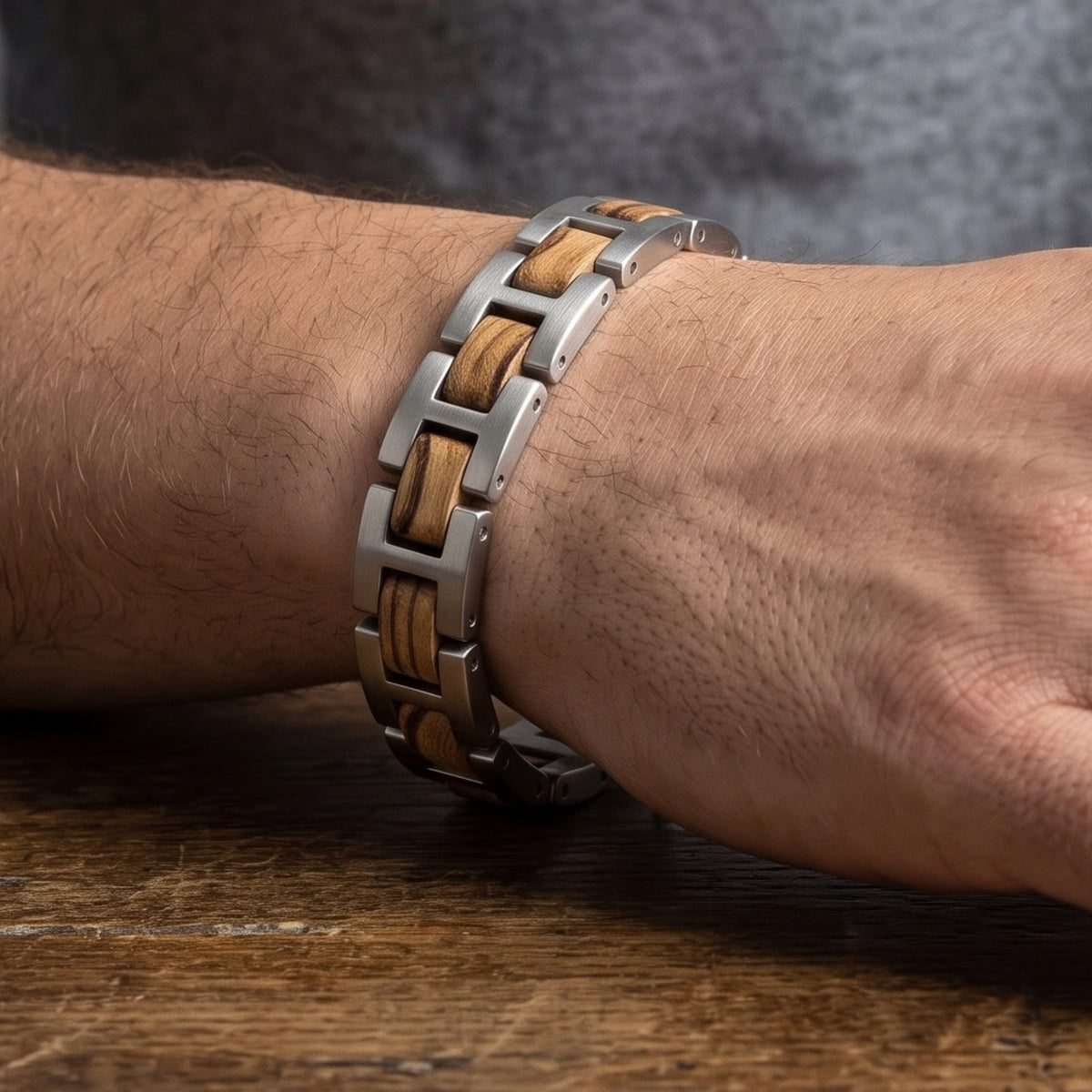 Zebrawood and stainless steel bracelet worn on wrist, side view of metal links, Overpowered Accessories