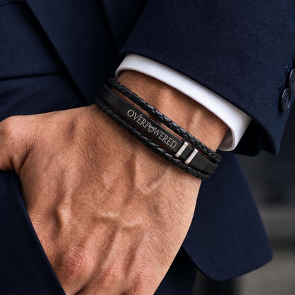 إسورة رجالي جلد أسود مضفّر بحواف بيضا وتفاصيل فضي وبتتظبط على المقاس، Overpowered Accessories