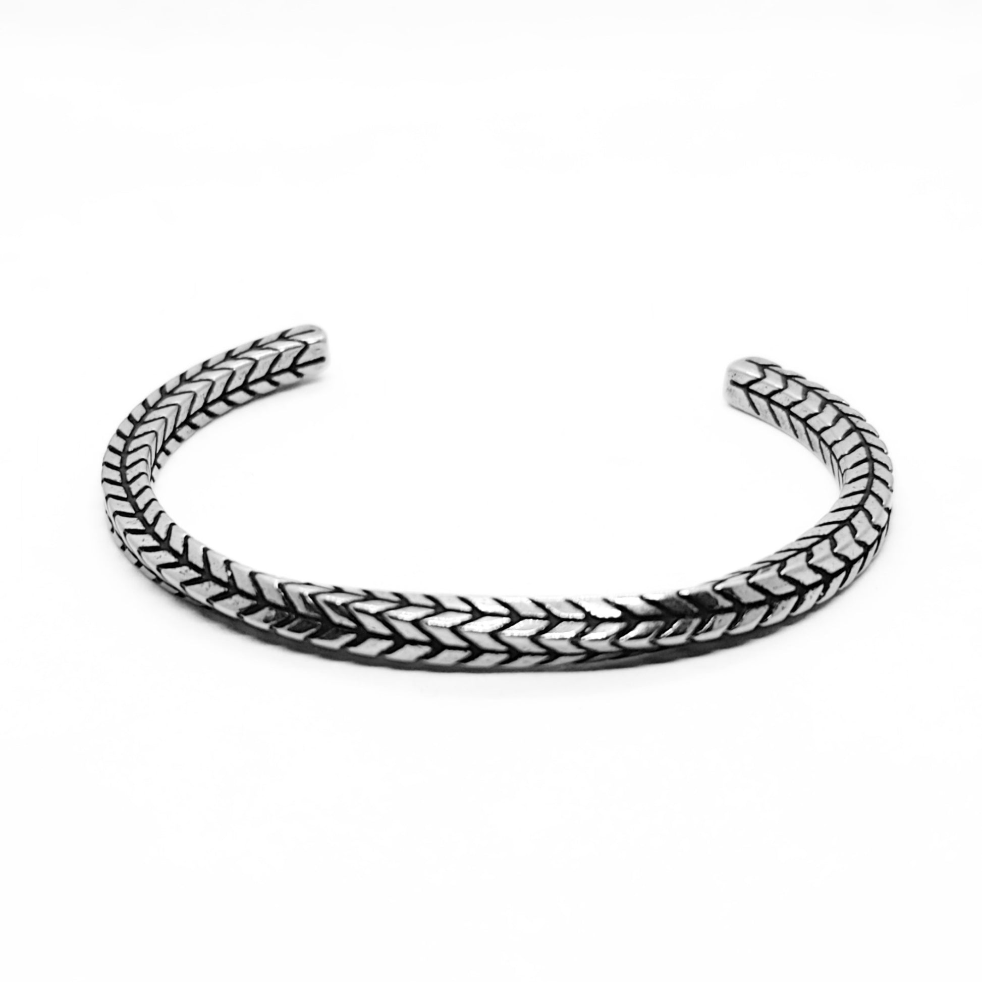 Silver stainless steel braided cuff bracelet, top view with open ends.