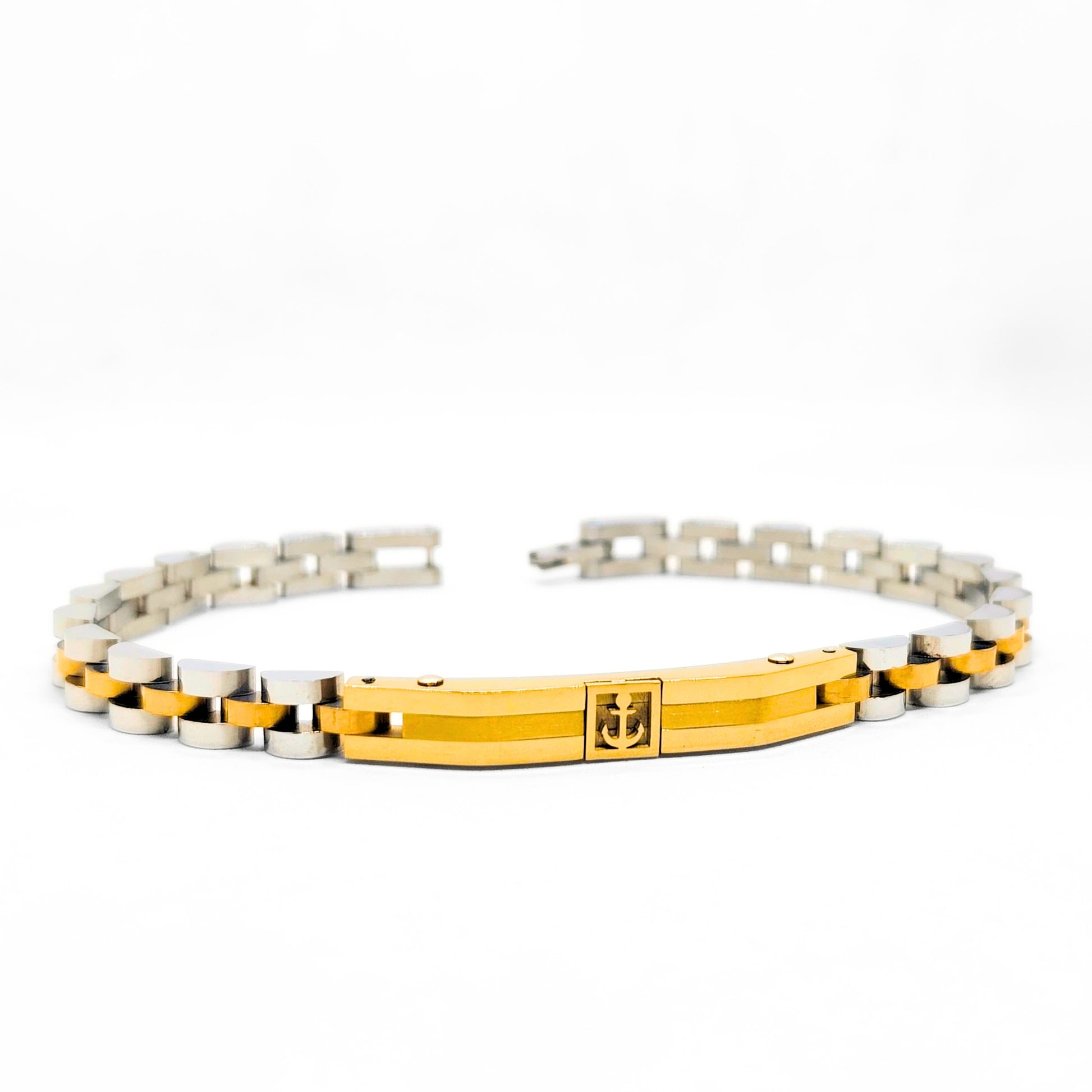 Two-tone anchor bracelet featuring a gold center bar with anchor emblem and silver links