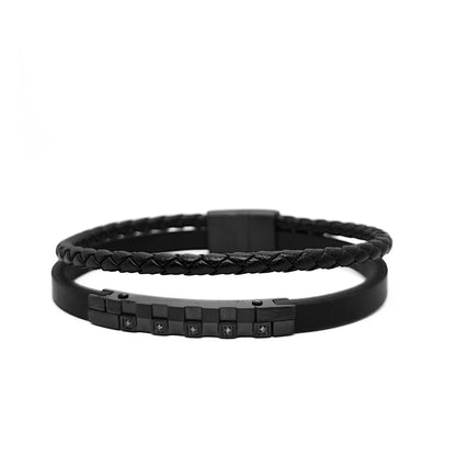 Men's black leather bracelet detail view, braided strap with square dark zircon accents.