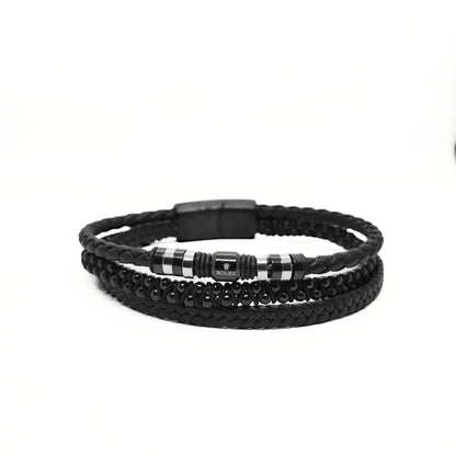Men's black leather wrap bracelet with braided texture and striped metal bead center