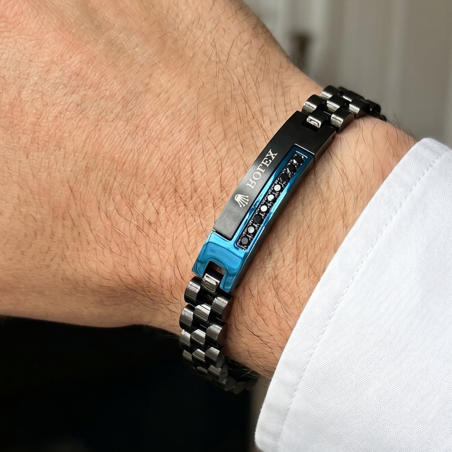 Blue and black stainless steel B-151 bracelet for men, featuring a sleek design and a secure clasp.