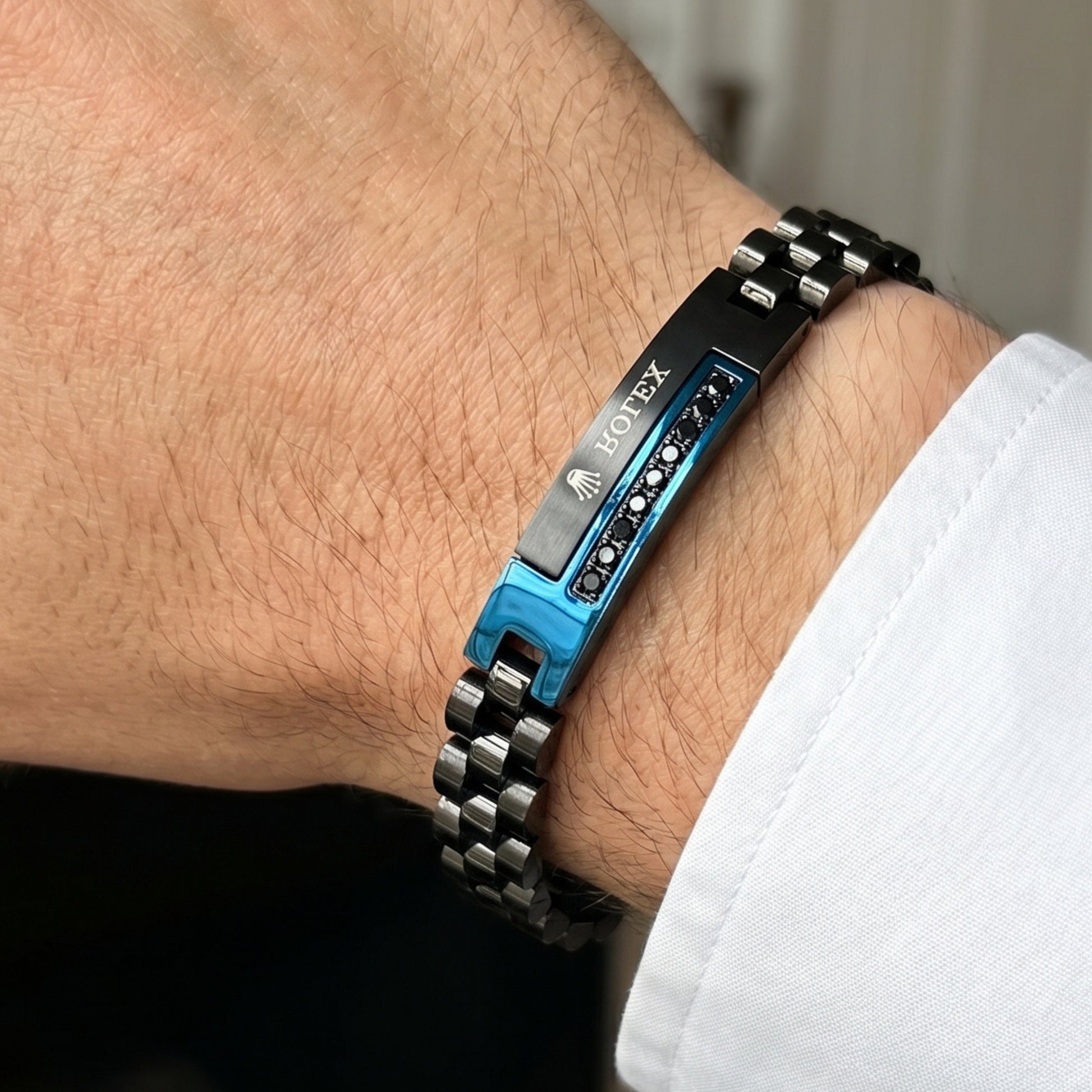 Blue and black stainless steel B-151 bracelet for men, featuring a sleek design and a secure clasp.