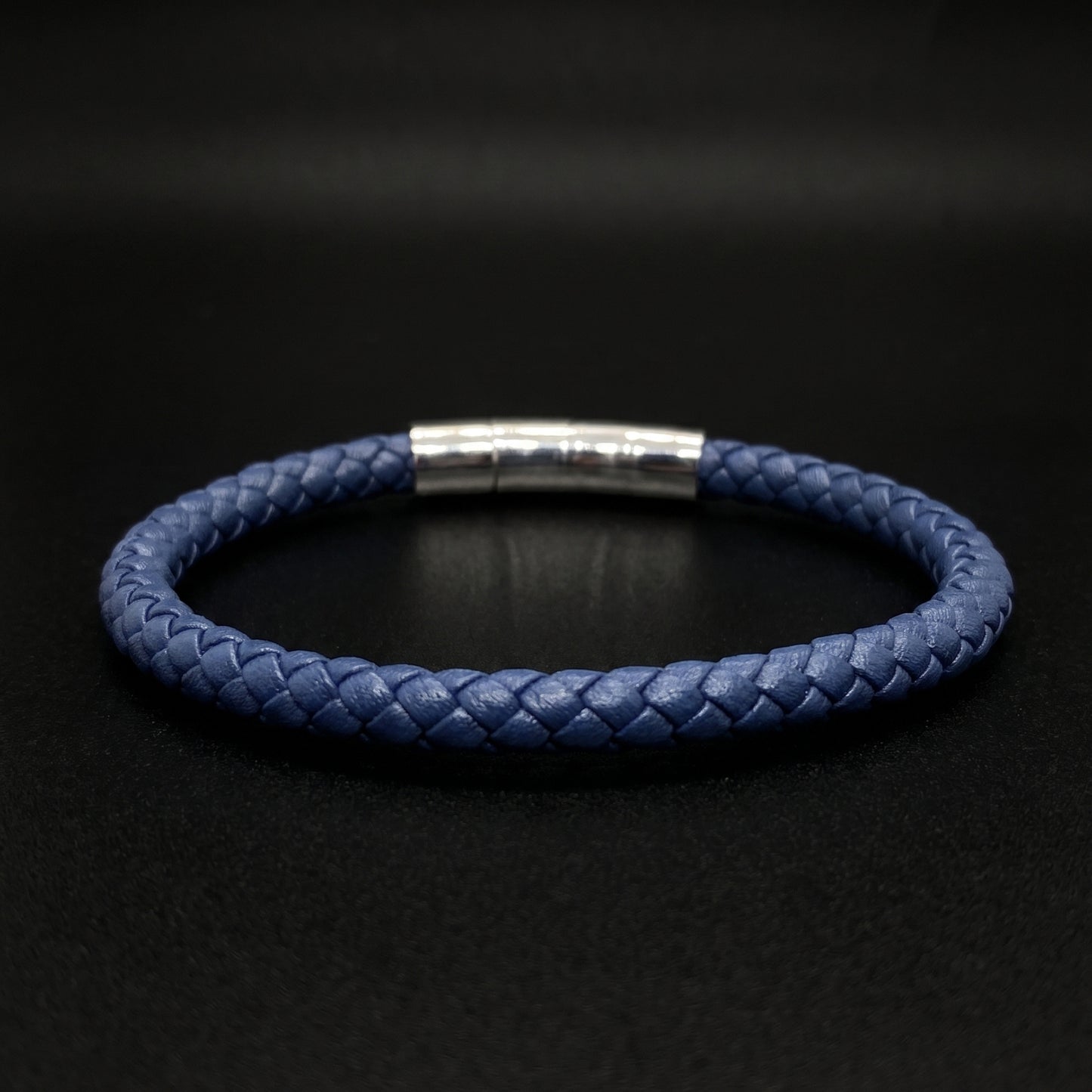 Dark blue braided leather bracelet with brushed silver band clasp