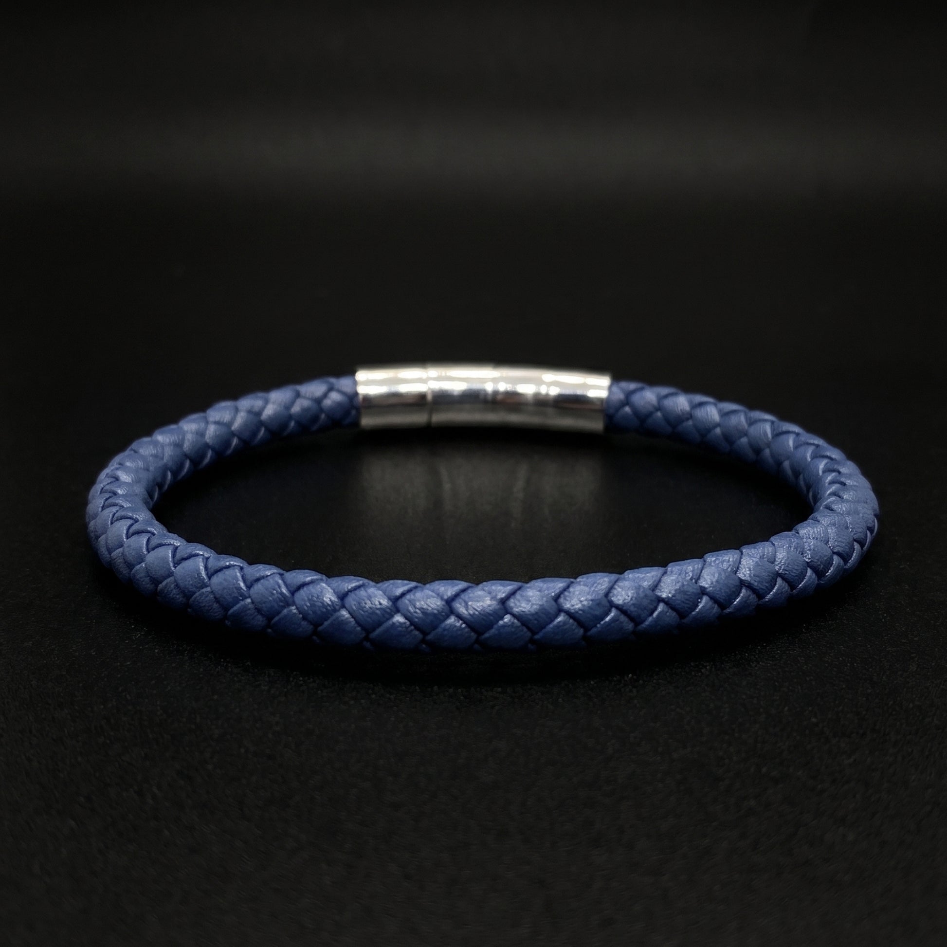 Dark blue braided leather bracelet with brushed silver band clasp