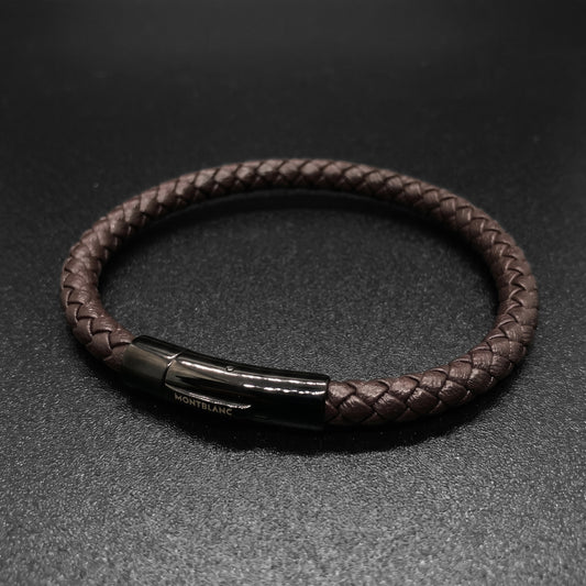 Brown braided leather bracelet with side view of rectangular clasp and logo