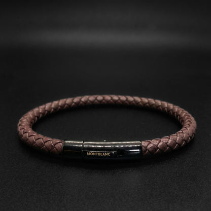 Brown braided leather bracelet with rectangular metal clasp and engraved logo