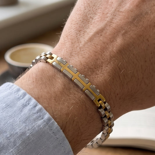 Two-tone silver and gold link bracelet with gold cross bar detail on arm