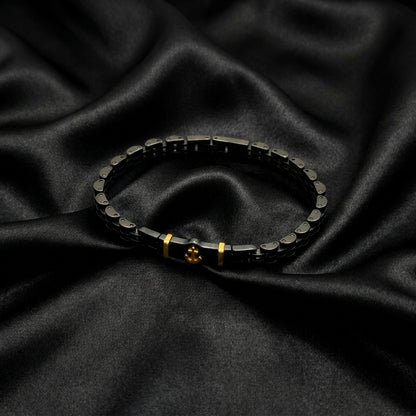 Black & Gold Anchor Stainless Steel B-145 Bracelet by Overpowered Accessories, featuring a sleek design on a dark fabric back