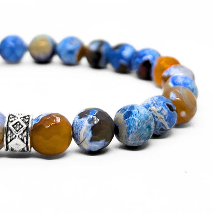Titan Meridian Bundle SG-002 features a men's bracelet made of blue and brown beads with a decorative silver accent.