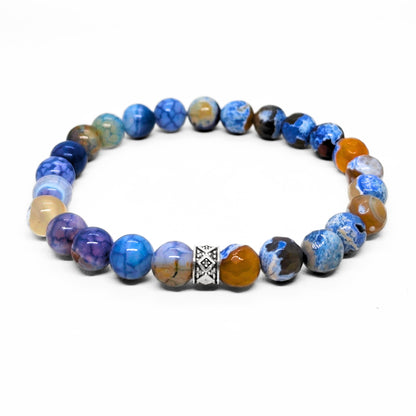 Blue agate beaded bracelet with silver-toned geometric spacer and gold-toned accents
