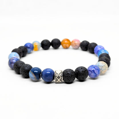 Men's beaded bracelet showing black lava and blue agate stones with a silver geometric centerpiece