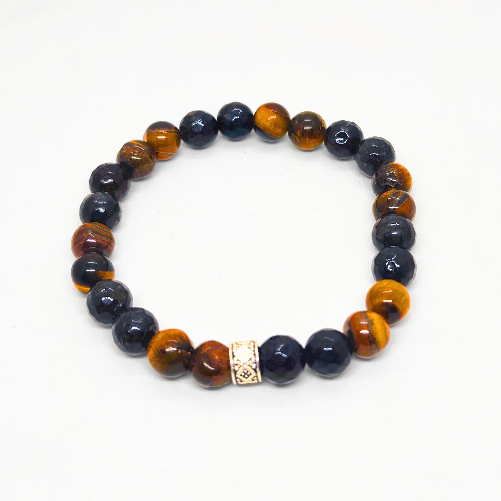 Mens beaded bracelet featuring dark blue beads with amber tiger eye highlights and a silver center charm