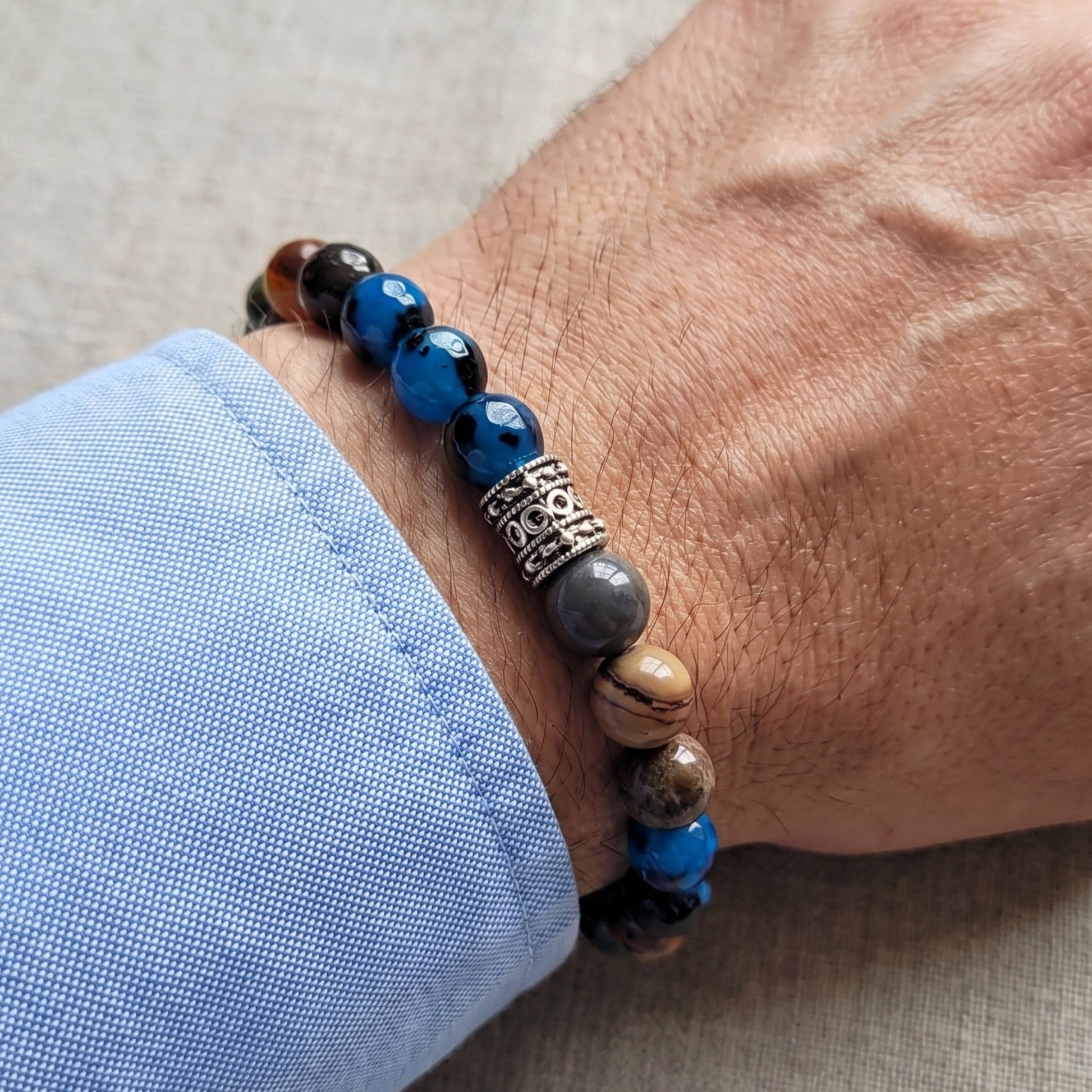 Natural Agate Stone G-23 Bracelet for men featuring a mix of blue, brown, and black beads with a decorative silver spacer.