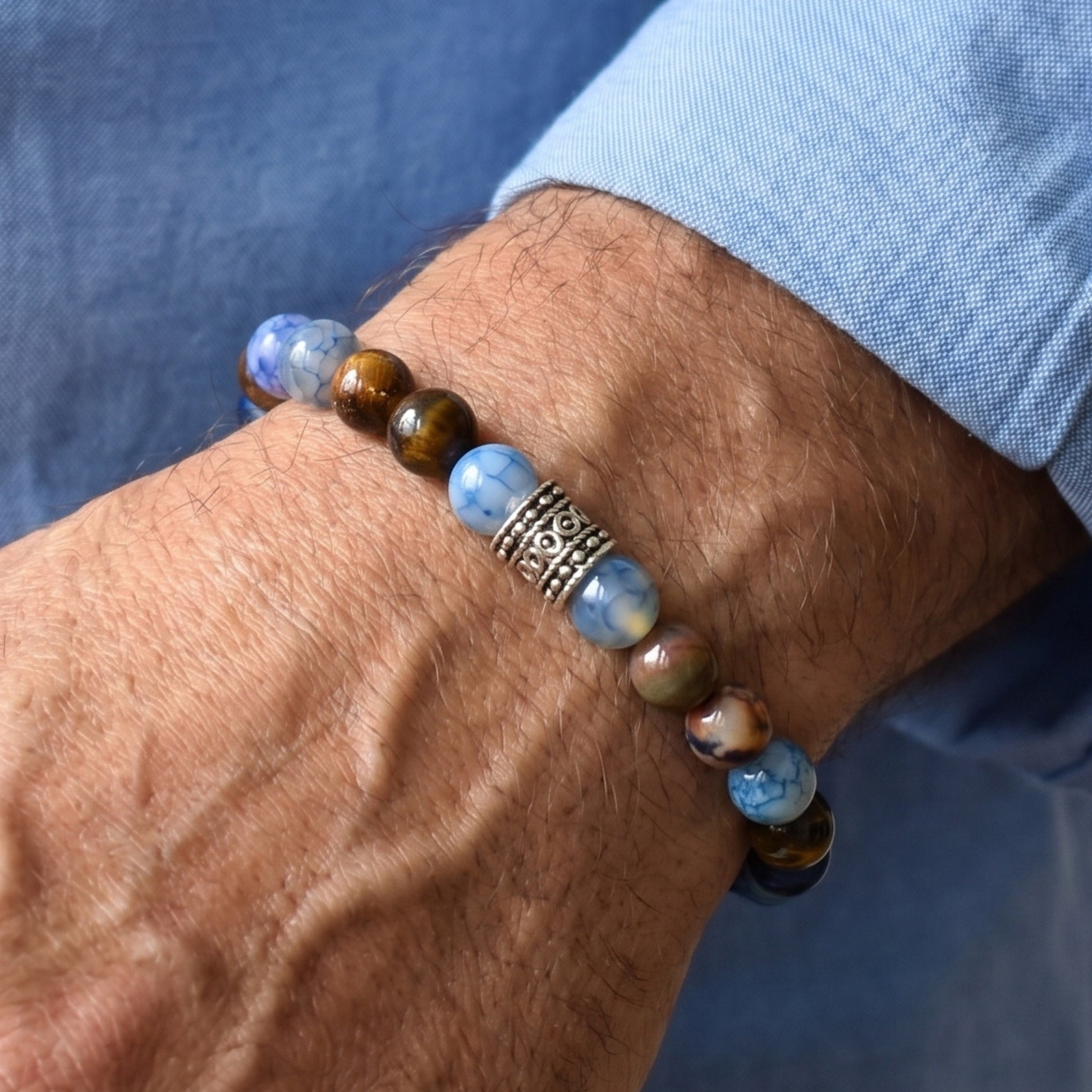 Natural Agate & Tiger Eye Gemstone G-24 Bracelet for men, featuring blue and brown beads with a decorative silver spacer.