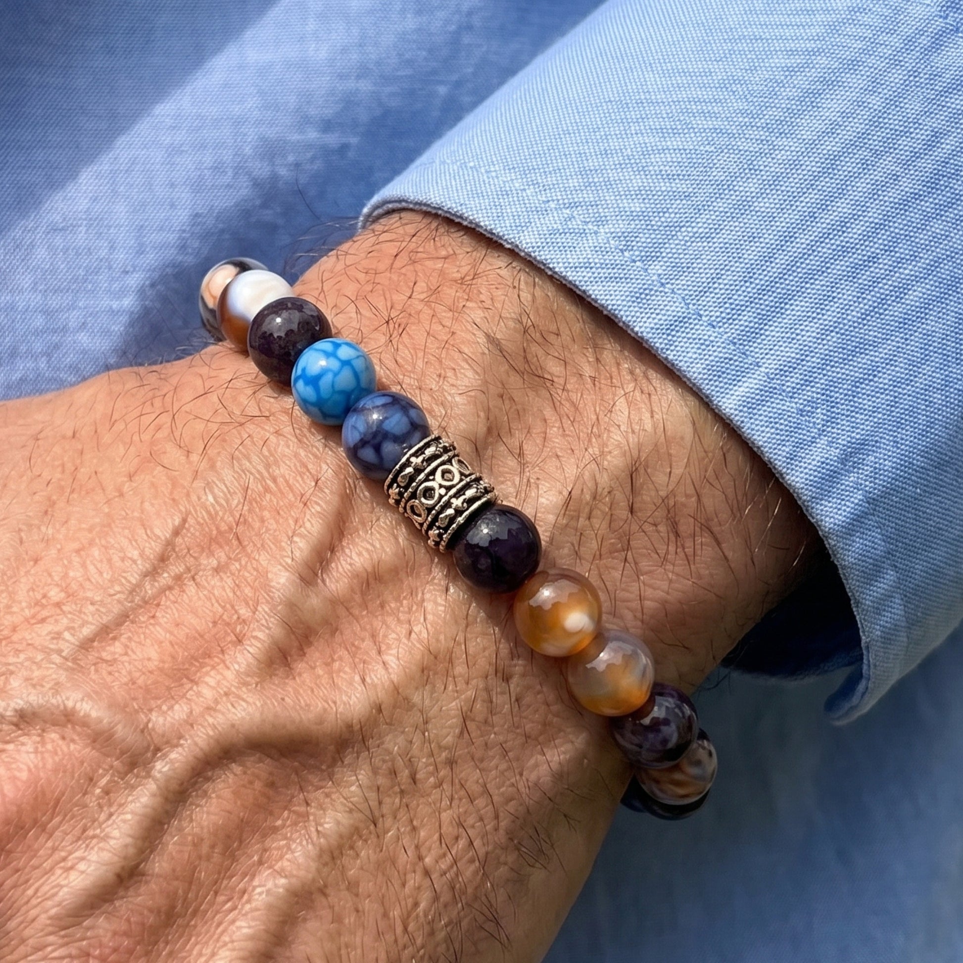 Natural Agate Stone G-25 Bracelet from Overpowered Accessories, featuring colorful beads and decorative silver accents on a w