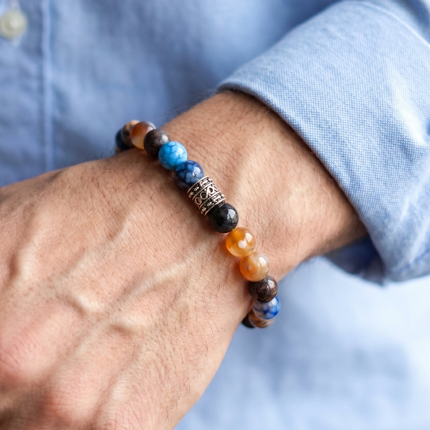 Natural Agate Stone G-25 Bracelet by Overpowered Accessories features colorful beads and a decorative silver accent, worn on 