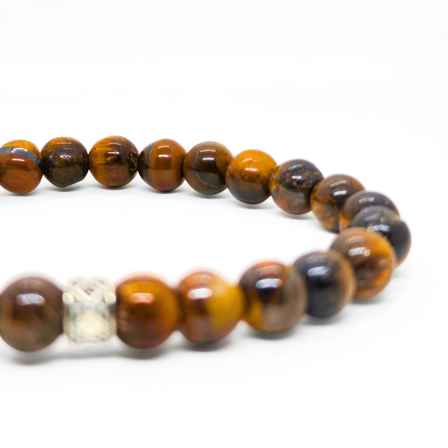 Tiger eye bead bracelet close-up with silver cube center and round brown stones