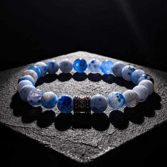 Men’s blue and white agate bead bracelet with dark patterned metal spacer