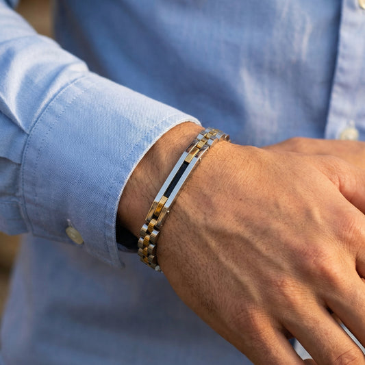 Tri-Color Silver, Gold, & Black Stainless Steel B-85 Bracelet on a man's wrist, showcasing a stylish design with a mix of met