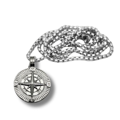 Silver steel compass pendant necklace with intricate design, featuring a chain for stylish wear. Ideal for adventurers.