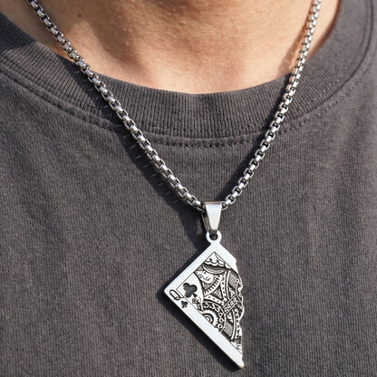 Silver PN-10 Queen Card Pendant necklace on a chain, worn by a person in a dark shirt. Intricate card design visible.