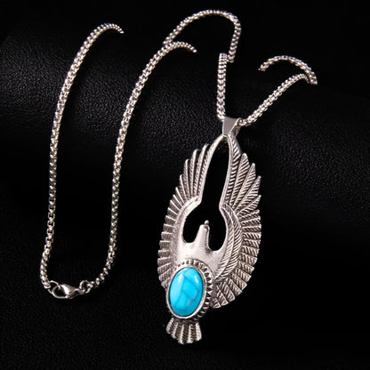 Silver eagle pendant necklace featuring turquoise stone and feathered wing details