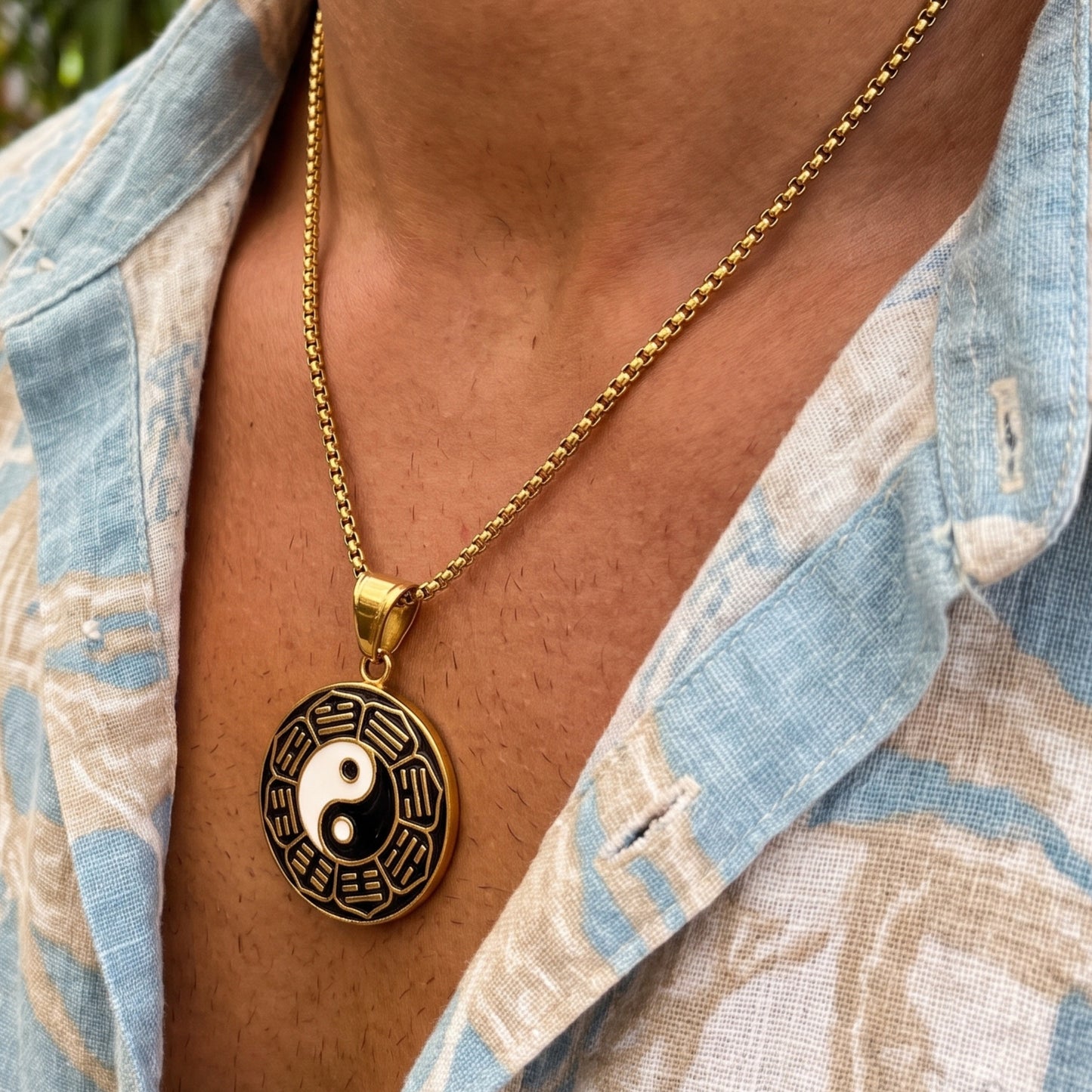 Gold yin-yang pendant necklace with round yin-yang charm and short link chain
