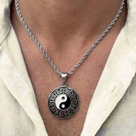 Silver yin-yang pendant necklace with round dark disc design and metal rope chain