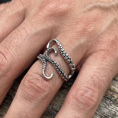 Minimalist Zinc Alloy R-2 Ring by Overpowered Accessories, featuring a unique design with textured detailing on a hand.