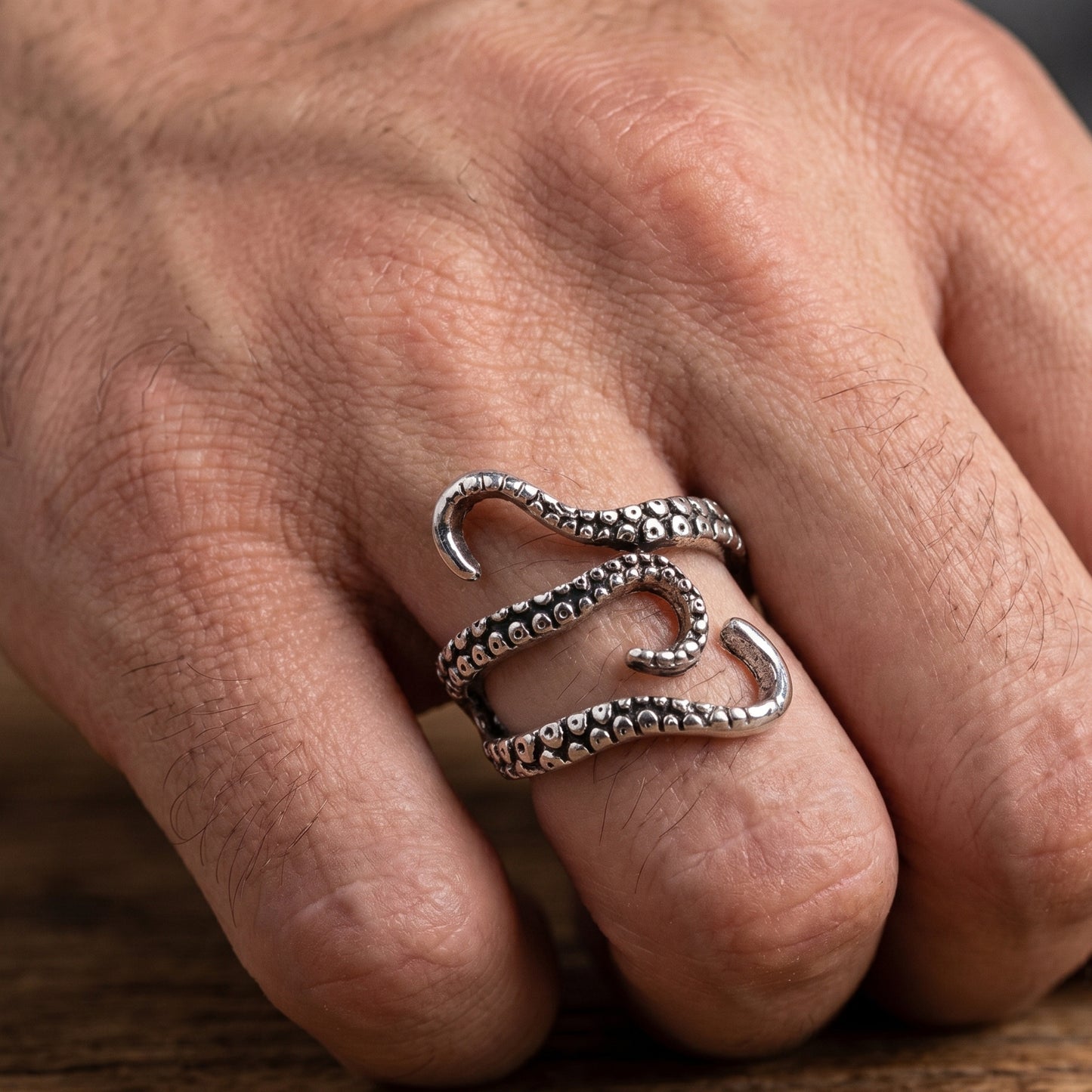 Minimalist Zinc Alloy R-2 Ring by Overpowered Accessories, featuring a unique octopus tentacle design on a hand.