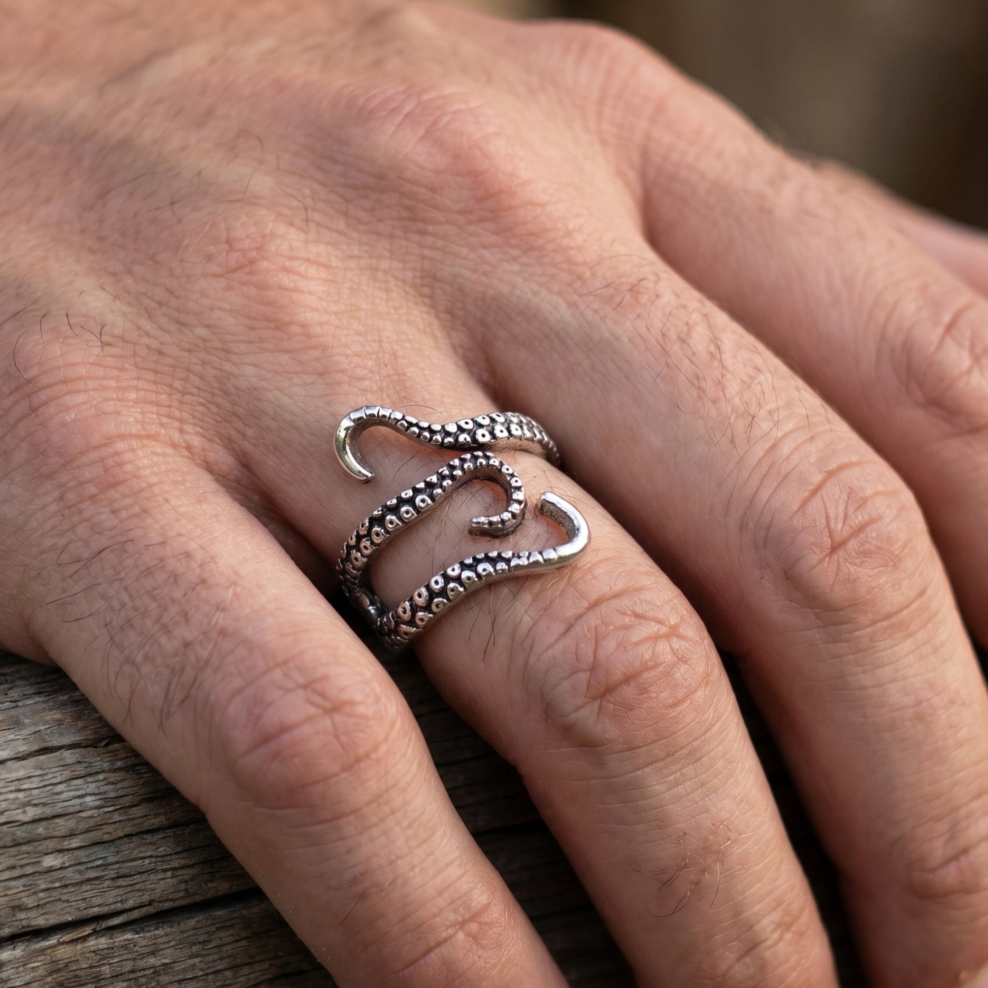 Minimalist Zinc Alloy R-2 Ring by Overpowered Accessories, featuring a unique octopus tentacle design on a hand.